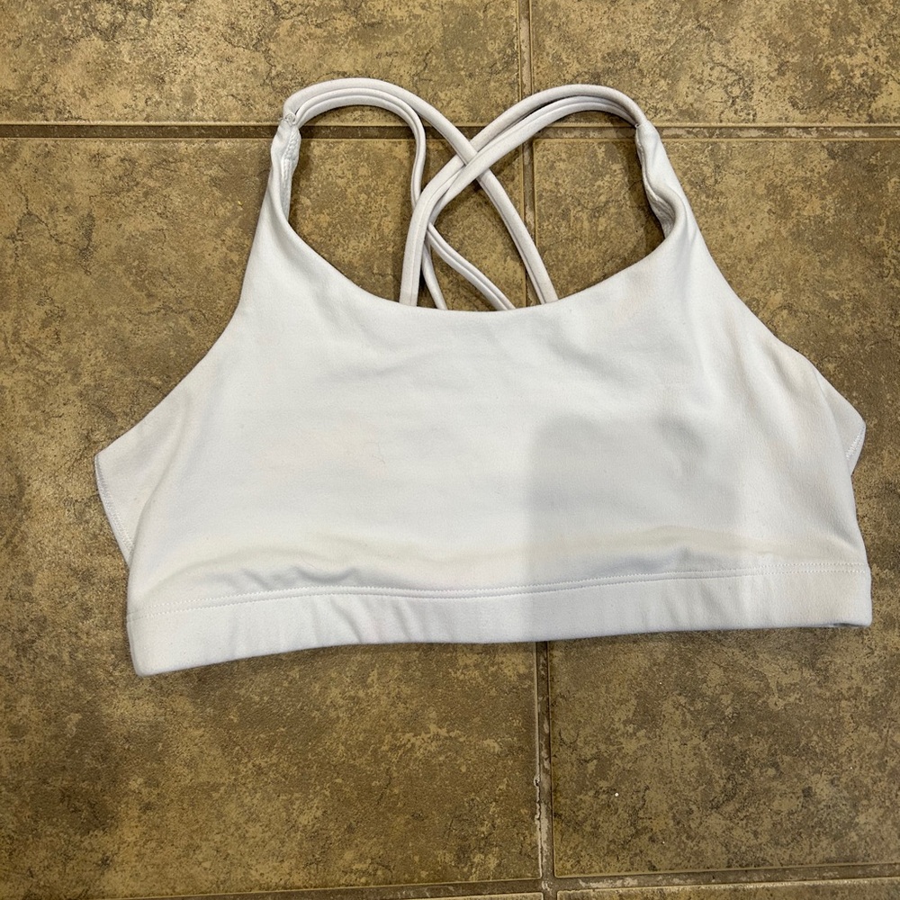White Athleta athletic bra. It’s a girls size XL but fits a women’s S